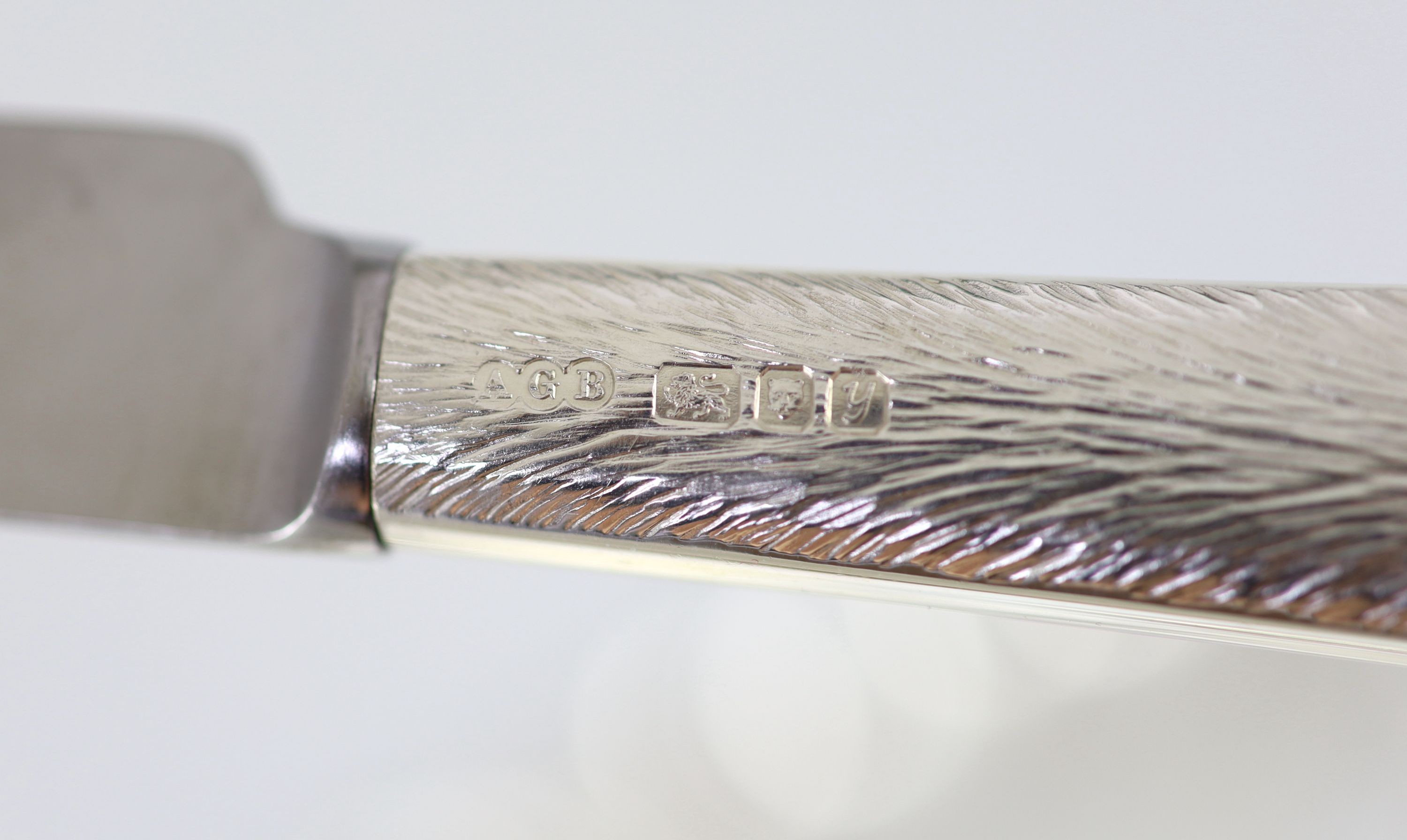 A good part textured silver canteen of cutlery for six by Adrian Gerald Benney